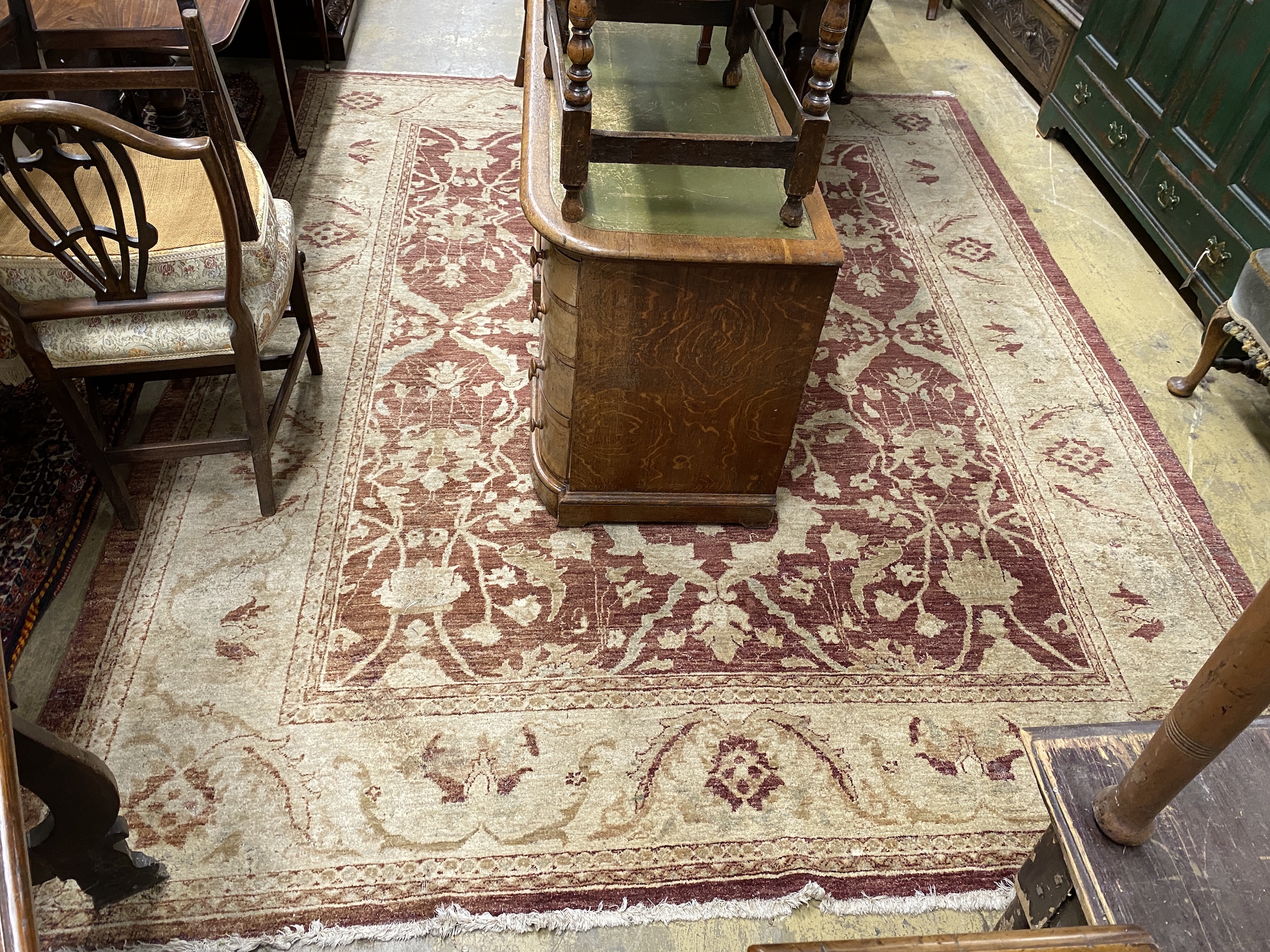 A Zeigler style burgundy ground carpet, 306 x 245cm